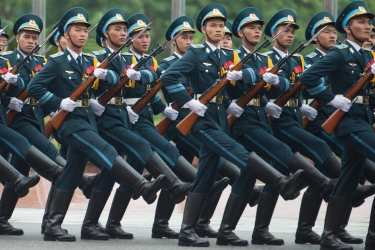 Vietnamese military members march during an honor guard ceremony at the Ministry of Defense in Hanoi, Vietnam