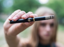 E-cigarette held by a young woman