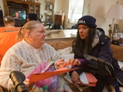 FEMA specialist assists a Hurricane Sandy survivor with medical issues