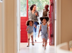 Family returning home, opening front door, photo by Monkey Business Images/Adobe Stock