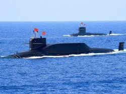 A nuclear-powered Type 094A Jin-class ballistic missile submarine of the Chinese People's Liberation Army Navy is seen during a military display in the South China Sea, April 12, 2018, photo by Stringer/Reuters