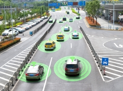 Autonomous vehicles driving on a city road with a graphic circle representing sensors. Photo by JIRAROJ PRADITCHAROENKUL / Getty Images