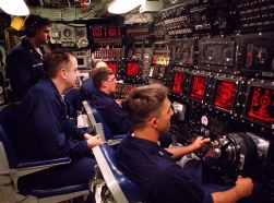 At sea aboard USS Seawolf, personnel man the underway main control watch