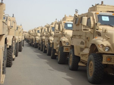 MRAPs lined up for deployment