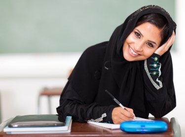 happy female middle eastern high school student