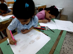 Children draw at a workshop of an association named "Our Children Are with Rebels" in Misrata, Libya, June 1, 2011