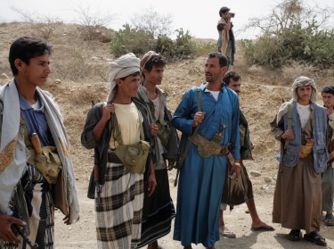 Yemeni Huthi rebels supervise the reopening of a road in Sa'da, north of San'a, on February 16, 2010, following a truce between the rebels and government forces that ended six months of fighting
