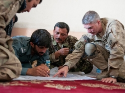 Soldiers discussing combined operations in Afghanistan, July 16, 2012