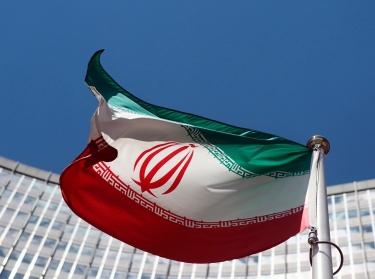 An Iranian flag flutters in front of the UN headquarters in Vienna June 17, 2014 as six world powers and Iran began their fifth round of nuclear negotiations