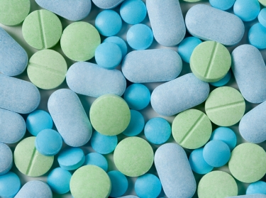 Blue and green pills and tablets