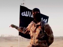 A masked man speaking in what is believed to be a North American accent in a video that Islamic State militants released in September