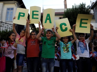 Children hold up letters spelling the word 'peace' during a day of activities and prayers at the Zaitoune historic church in old Damascus, Syria, June 1, 2016