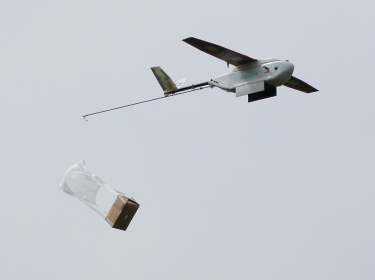 A Zipline delivery drone releases its payload during a demonstration near San Francisco, California, May 5, 2016