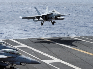 An F/A-18 Super Hornet lands on the deck of the USS Ronald Reagan in the South China Sea, September 30, 2017