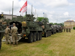 Members of Battle Group Poland stage their vehicles upon arriving at the city of Suwalki, Poland, during an exercise to enhance NATO throughout the Baltic region and Poland, June 17, 2017