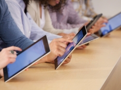 Students using digital tablets