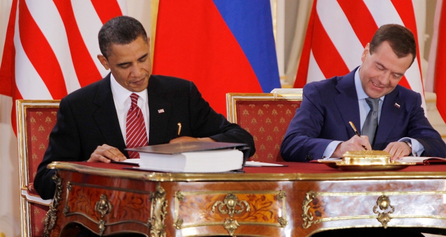 U.S. President Barack Obama and Russian President Dmitry Medvedev exchange the signed new Strategic Arms Reduction Treaty (START II) at Prague Castle in Prague, April 8, 2010