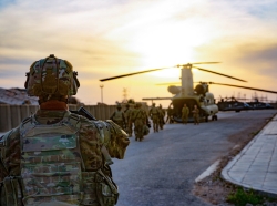 U.S. soldiers load onto a CH-47 Chinook helicopter as they leave Al Qaim Base, Iraq, March 9, 2020, photo by Spc. Andrew Garcia/U.S. Army