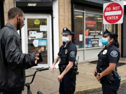 Camden County Police officers patrol on the streets of Camden, New Jersey, amid nationwide protests in the aftermath of the death in Minneapolis police custody of George Floyd, June 11, 2020, photo by Jessica Kourkounis/Reuters