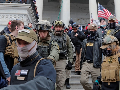 Jessica Marie Watkins (second from left) and Donovan Ray Crowl (center), both U.S. veterans who have since been indicted for their roles in the Caption riot, in Washington, D.C., January 6, 2021