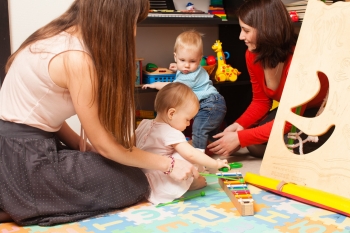 Children with mothers in the playroom