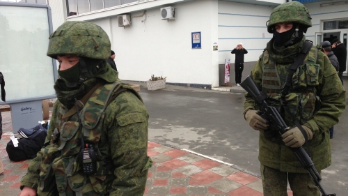 Unidentified gunmen on patrol at Simferopol Airport in Ukraine's Crimea peninsula. The AK-74 carried by the rifleman on the right does not have a magazine inserted.
