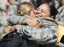 Airmen embrace after returning from deployment