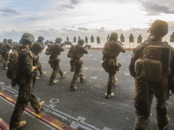 Marines train on the deck of a ship during a deployment