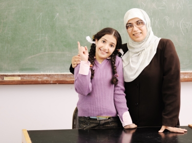 Teacher and little girl together