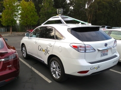 One of Google's self-driving cars picturesd in a parking lot.