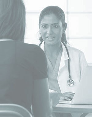 A physician speaks with a patient.