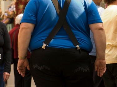 Obese man in a crowd