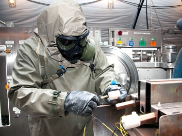 A worker engages in decontamination procedures