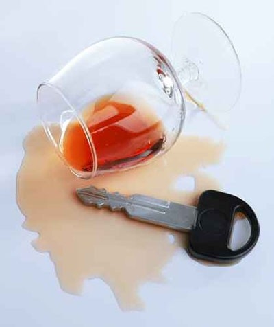 A spilled glass of cognac and car key