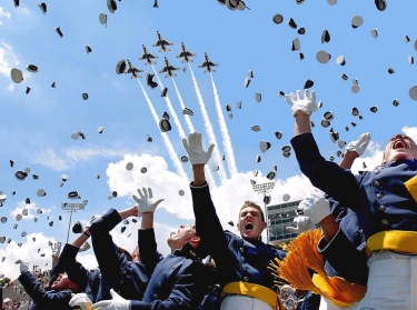 Cadets of the Air Force Academy Class of 2003 celebrate at graduation ceremonies on May 28, 2003 as the Air Force Thunderbirds fly overhead
