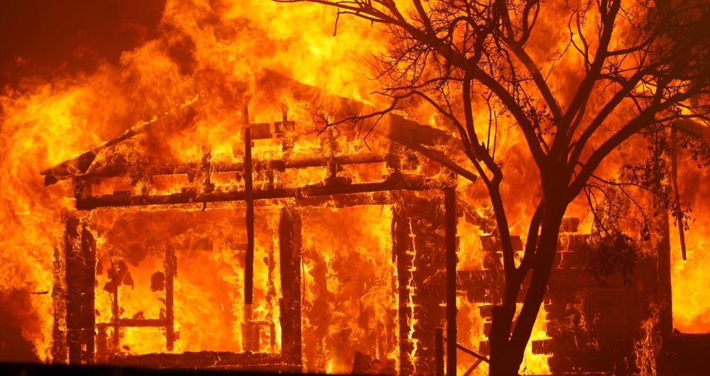 A house burning along Cherry Glen Road during the LNU Lightning Complex Fire on the outskirts of Vacaville, California, August 19, 2020