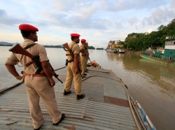Indian security personnel on the Brahmaputra River in Guwahati, India, August 6, 2014