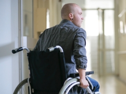 A young man in a wheelchair