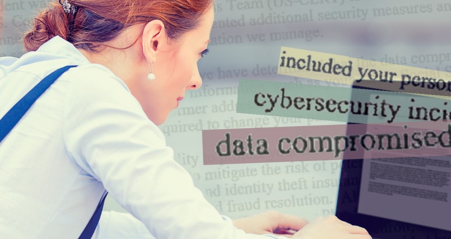 A woman reading an email notification about a data breach