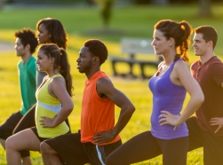 Diverse group of adults in an outdoor fitness class