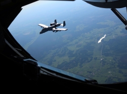 An A-10C Thunderbolt II flies near a KC-135 Stratotanker after departing from Amari Air Base, Estonia, during an exercise with the Estonian Air Force and Maryland Air National Guard, June 3, 2013