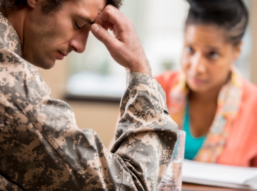 Depressed veteran meets with psychologist