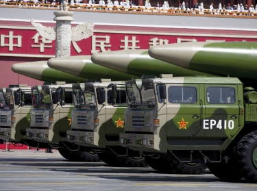 Military vehicles carrying DF-26 ballistic missiles travel past Tiananmen Gate during a military parade to commemorate the 70th anniversary of the end of World War II in Beijing, September 3, 2015