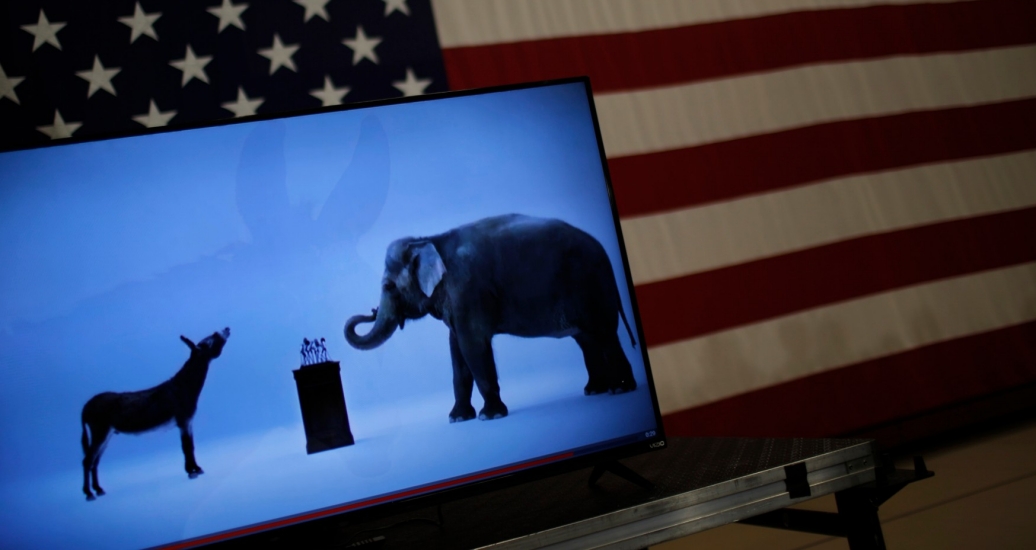 The mascots of the Democratic and Republican parties are seen on a video screen at U.S. presidential candidate Hillary Clinton's campaign rally in Cleveland, Ohio, March 8, 2016