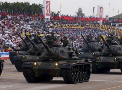 Taiwanese soldiers salute from tanks during a military exercise in Hsinchu, northern Taiwan, July 4, 2015