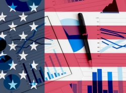 Composite image of U.S. flag with graphs and a pen