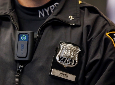 A police body camera is worn by an officer during a news conference on the pilot program of body cameras involving 60 NYPD officers dubbed Big Brother at the NYPD police academy in Queens, New York, December 3, 2014