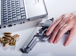 A laptop computer, a 9mm handgun, and bullets