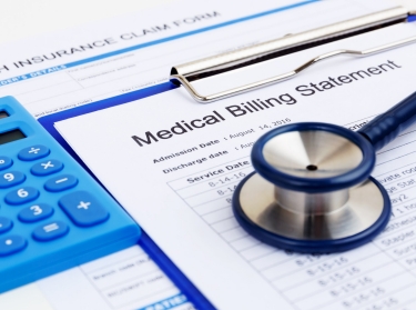 Medical bill and health insurance form with calculator