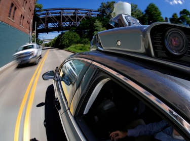 A self-driving Uber drives in Pittsburgh during a media preview